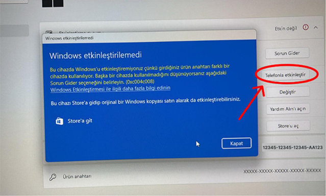 Windows etkinleştirme ekranında 'Telefonla etkinleştir' seçeneğine tıklama